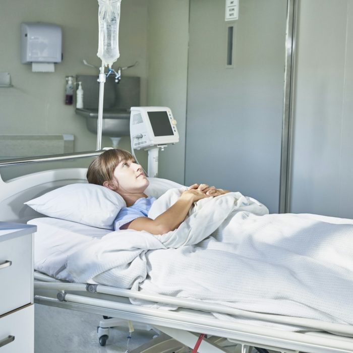 Woman laying down in hospital bed